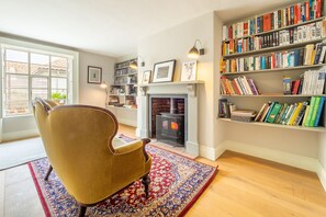 Grove Farm House, Thornham Magna: Snug with wood burning stove