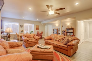 Great Room with Dining Area next to the Windows, Library and Laundry Room Right.