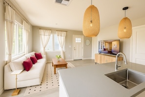 Open Space living room with 65" 4K TV and Surround sound.