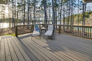 Deck off of screen porch, with steps leading to the lake (gas grill included)