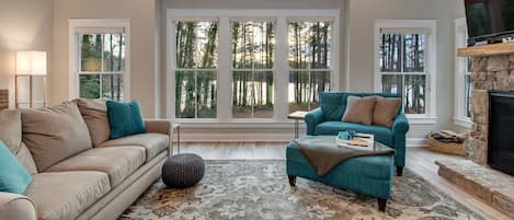 Beautiful family room with a panoramic lake view