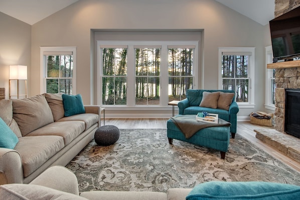 Beautiful family room with a panoramic lake view