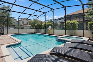 Heated private pool and spa with lounge chairs and outdoor seatings