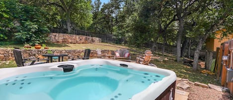 Private hot tub in fenced yard.