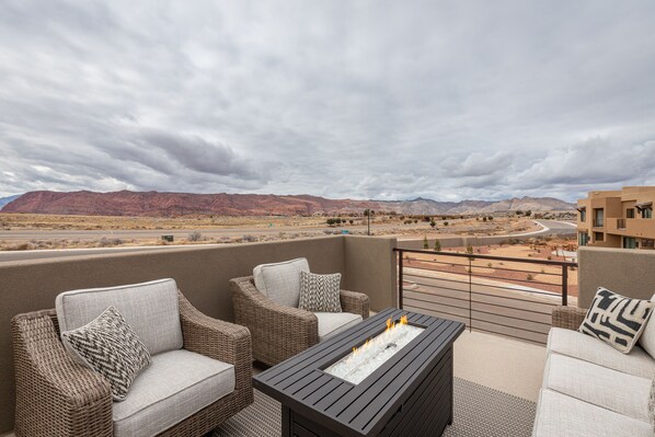 Upstairs Patio Views of Snow Canyon - Stay warm next to the fire-pit and relax while watching the sunset over the red mountains.