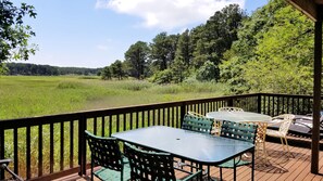 Lower deck with wonderful views has tables and lounge chairs