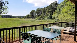 Lower deck with wonderful views has tables and lounge chairs