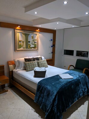 Master Bedroom with Queen bed and windows that look out to the ocean! 