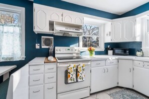 Brightly lit kitchen with all the amenities you need for gourmet meals.