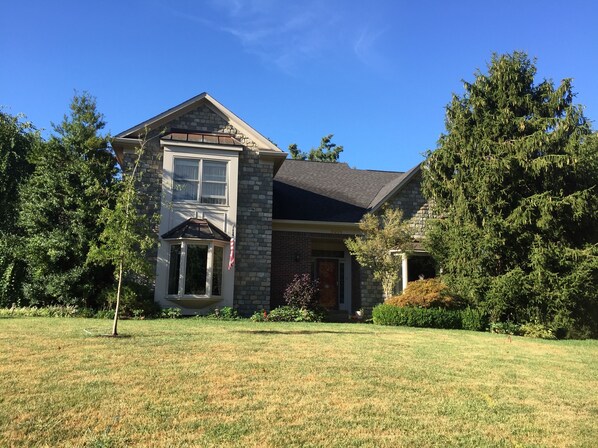 Front elevation showing bay windows, copper roofs and granite cobblestones