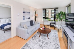 Warm & Comfortable Living Room with Fireplace & 55" Smart TV. 
Spacious living space, perfect for a couple  touring the sites of Victoria. 