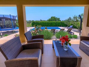 Sky, Furniture, Plant, Property, Table, Flower, Building, Flowerpot, Azure, Blue