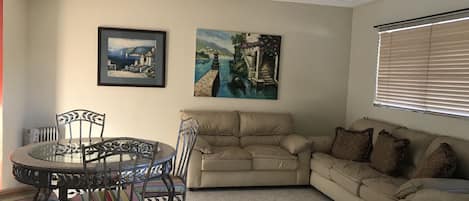 Living Room with dining table and couch.