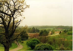 Front porch view. Midway Barn, part of the Taliesin estate, is upper right.