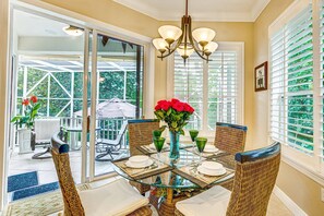 Dining nook area for 4 right off the kitchen.  Access to the screened lanai.