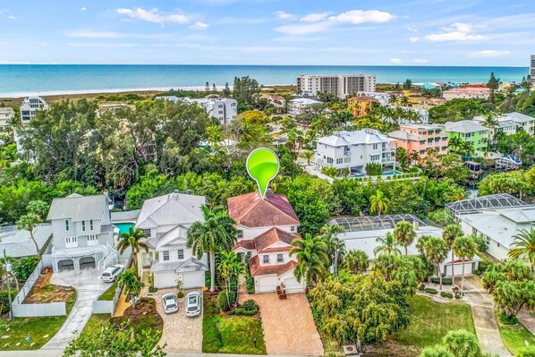Aerial shot of Palm Island home on Siesta Key, close to beaches and the Village.