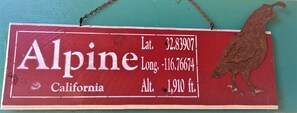 Alpine sign is located outside of La Casita's lower deck. 