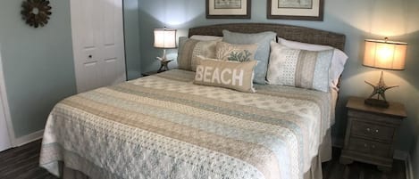 Relax in shades of aqua/sand and memory foam mattress in king master BR