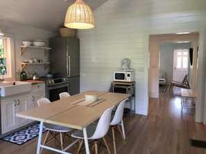 Hallway leads past sleeping nook to living room