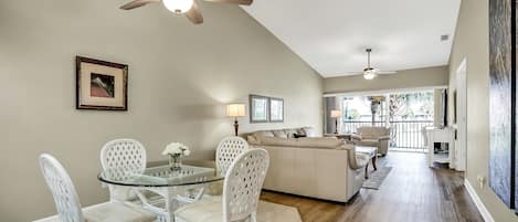 Dining area, Living room w glass doors to large lanai that overlooks pond.