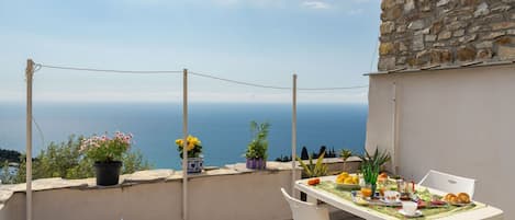 Water, Table, Tableware, Property, Sky, Furniture, Building, Window, Blue, Chair