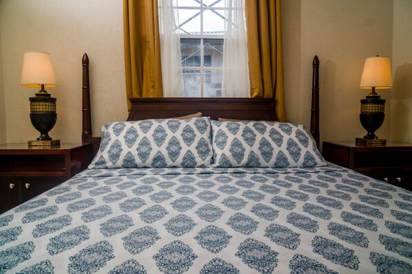 Bedroom #2. King bed. Room has built in vanity and  closet. TV. Air-conditioning