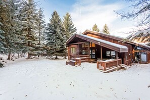 Enjoy the views of the yard, outdoor living area and hot tub