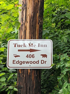 Driveway sign leads you to Tuck Me Inn