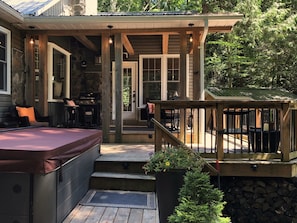 Deck and Hot tub leading to the front porch entrance.
