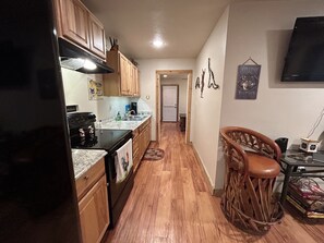 Entrance to bedroom with a full walk in closet