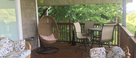 Relax in swinging chair and enjoy outdoor dining with amazing views of wildlife 