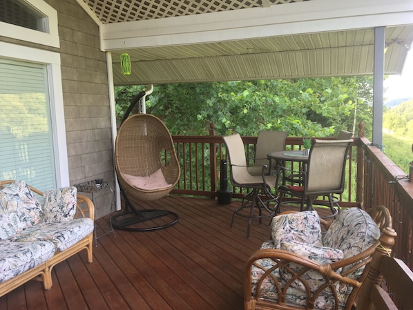 Relax in swinging chair and enjoy outdoor dining with amazing views of wildlife 