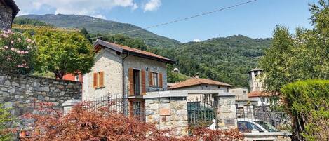 Sky, Cloud, Plant, Daytime, Property, Building, Mountain, Window, Natural Landscape, Tree