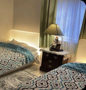 Beautiful green second bedroom.