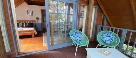 Private covered balcony upstairs with lake views.