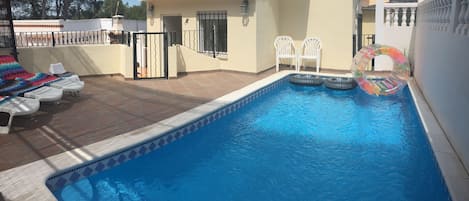 Pool patio and front of property