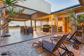 The outdoor entertaining area is weather protected with a large pergola.