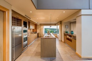 The spacious kitchen is fully-equipped for your holiday catering.