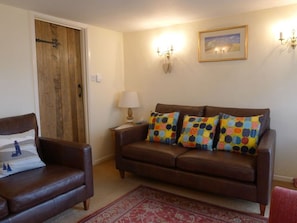 Cosy front room-2 x leather (John Lewis) sofas.