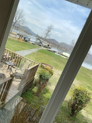 View from dining room across deck onto lake.