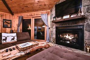 Gather around the stone fireplace after a day on the slopes or trails. The warm, wood-accented interior invites relaxation, with streaming-ready entertainment at your fingertips.