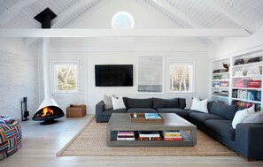 stylish great room with seating for the whole family. wood burning fireplace. 