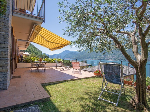 Water, Plant, Furniture, Property, Sky, Building, Shade, Tree, Outdoor Furniture, Chair