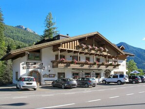 Car, Sky, Building, Mountain, Window, Vehicle, Wheel, Plant