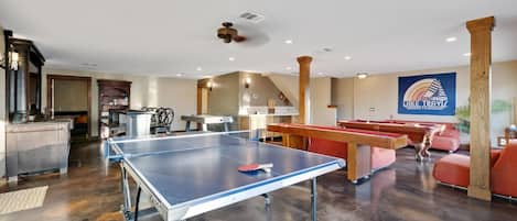 Game room w/ pool table, shuffleboard, air hockey, ping pong table & Ms. Pac-man