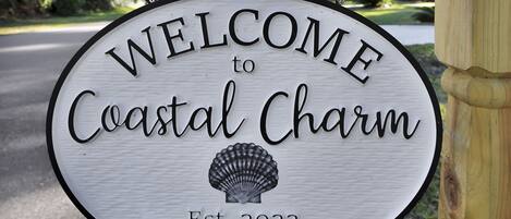 Coastal Charm sign on mailbox