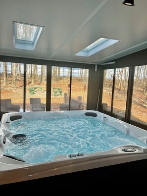 Brand new hot tub, located in 3 seasons room