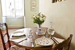 The dining table in the bright and sunny salon.