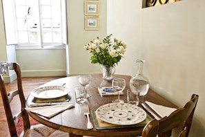 The dining table in the bright and sunny salon.