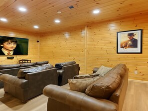 Home Movie Theater - 73” HDTV, surround-sound, 3-D capabilities, a Blu-ray player, a library of DVDs and even a wet bar.